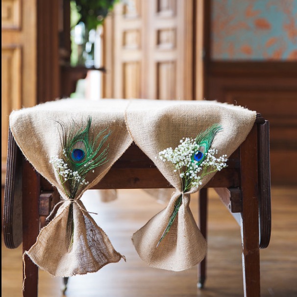 Peacock feather and flower chair styling
